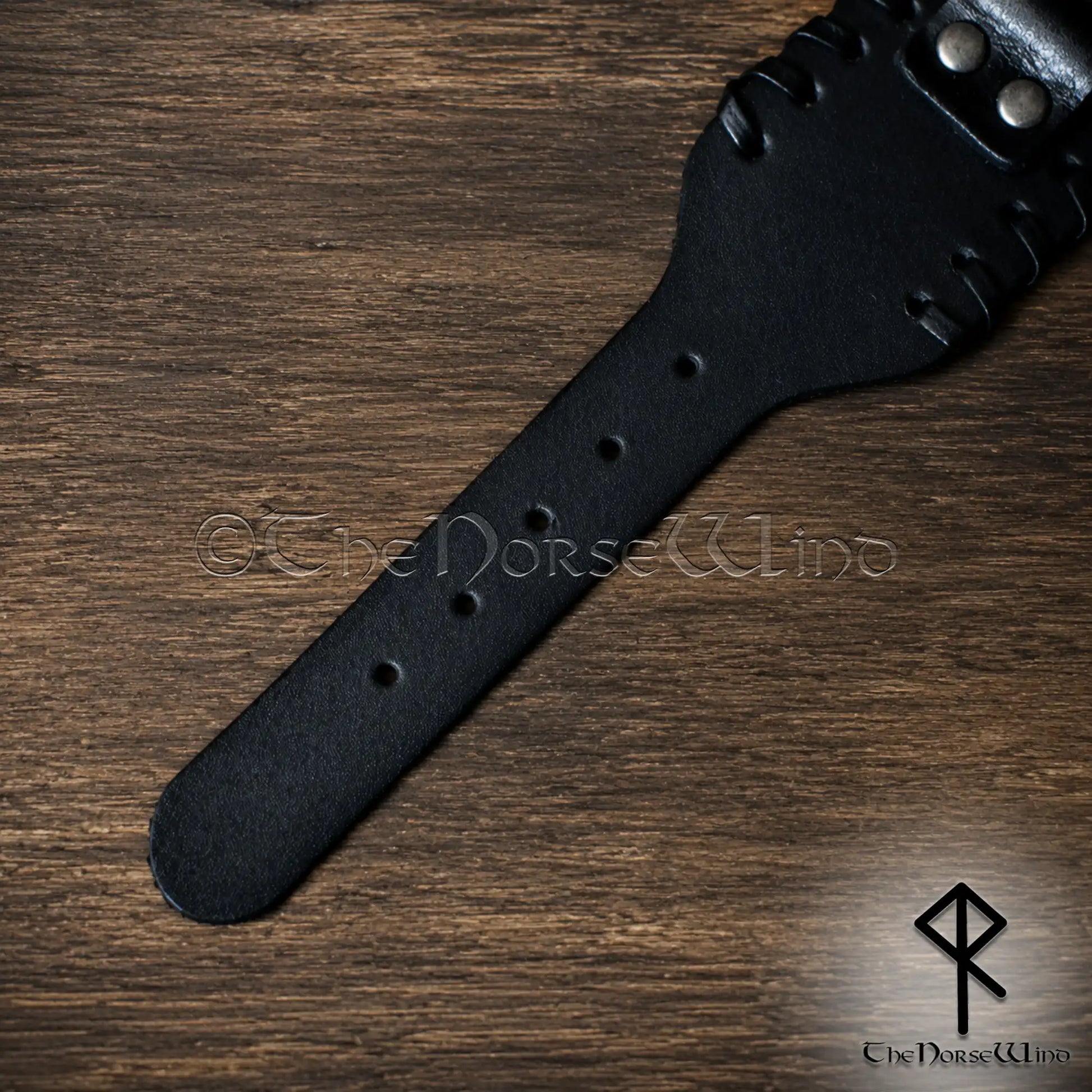 Five-hole adjustable fastening on black Viking leather wristband