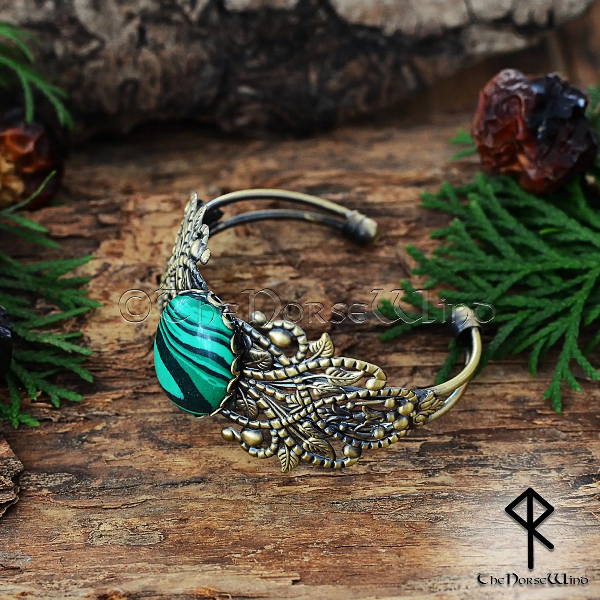 Viking women’s bronze cuff with ornate filigree and malachite