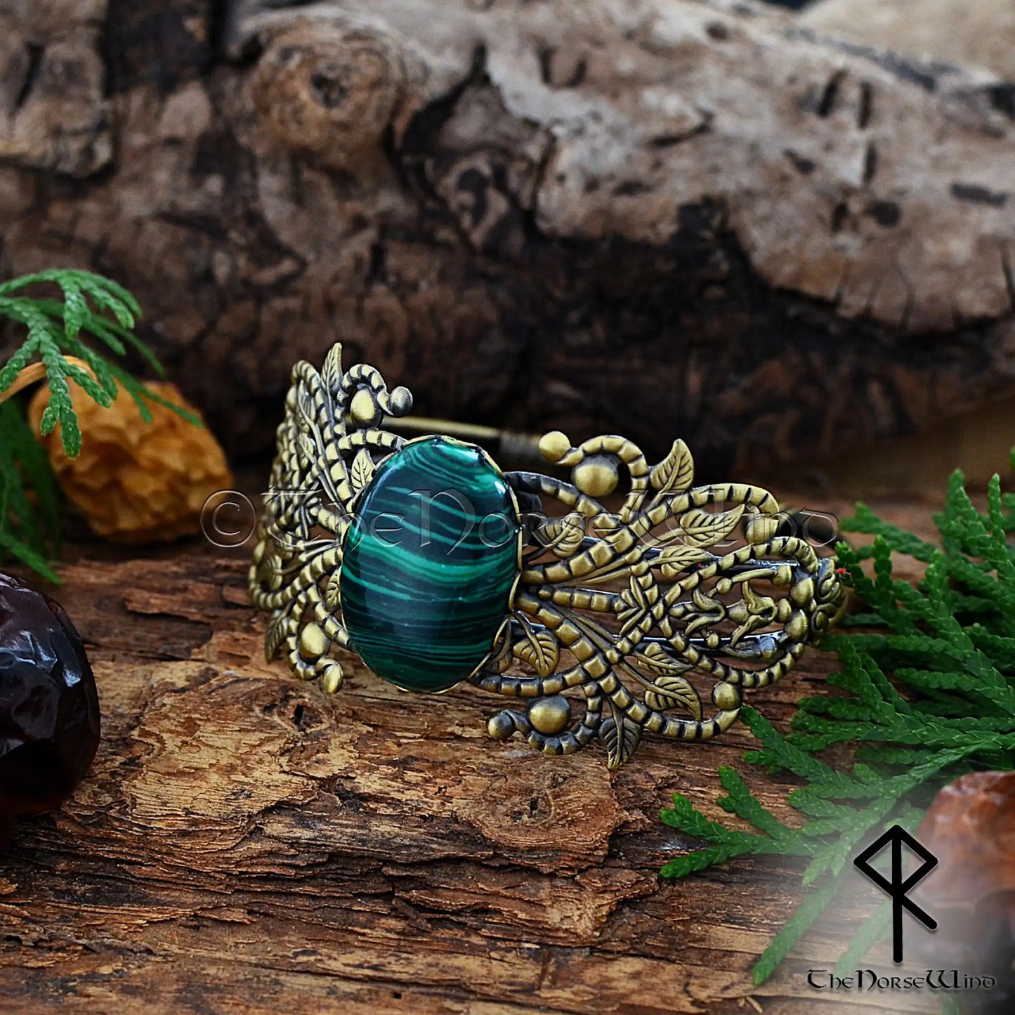 Viking women’s bronze cuff with ornate filigree and malachite