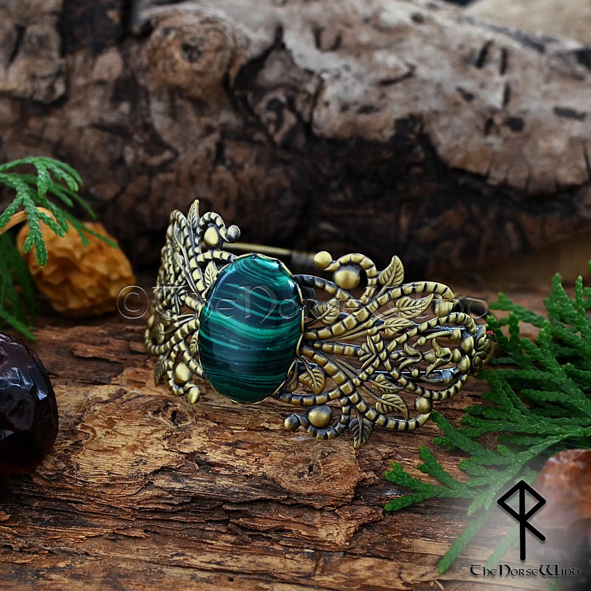 Viking women’s bronze cuff with ornate filigree and malachite