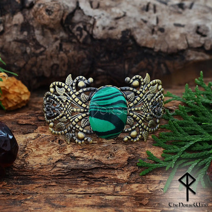 Viking women’s bronze cuff with ornate filigree and malachite