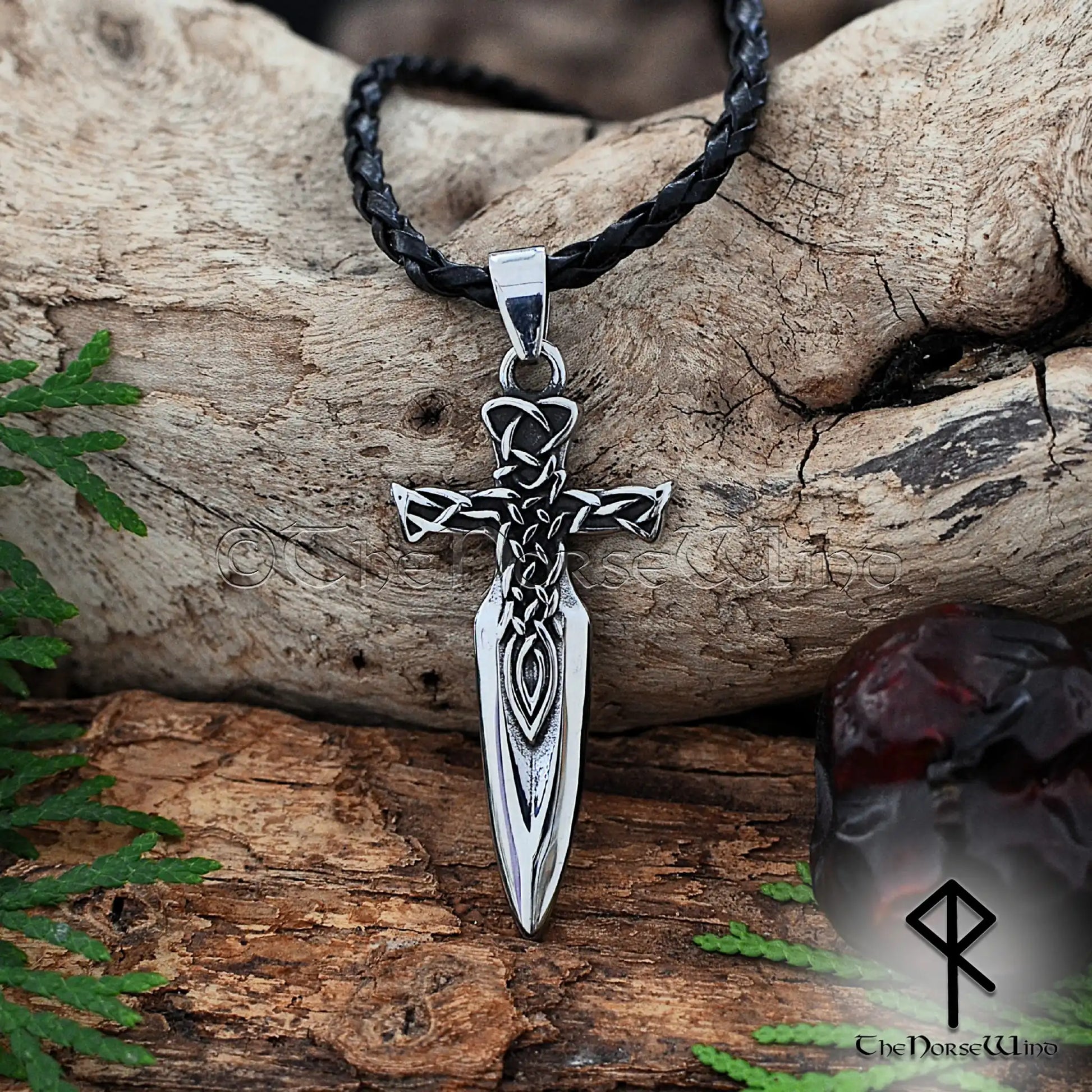 Silver dagger pendant on a black leather cord with Celtic knots engraving